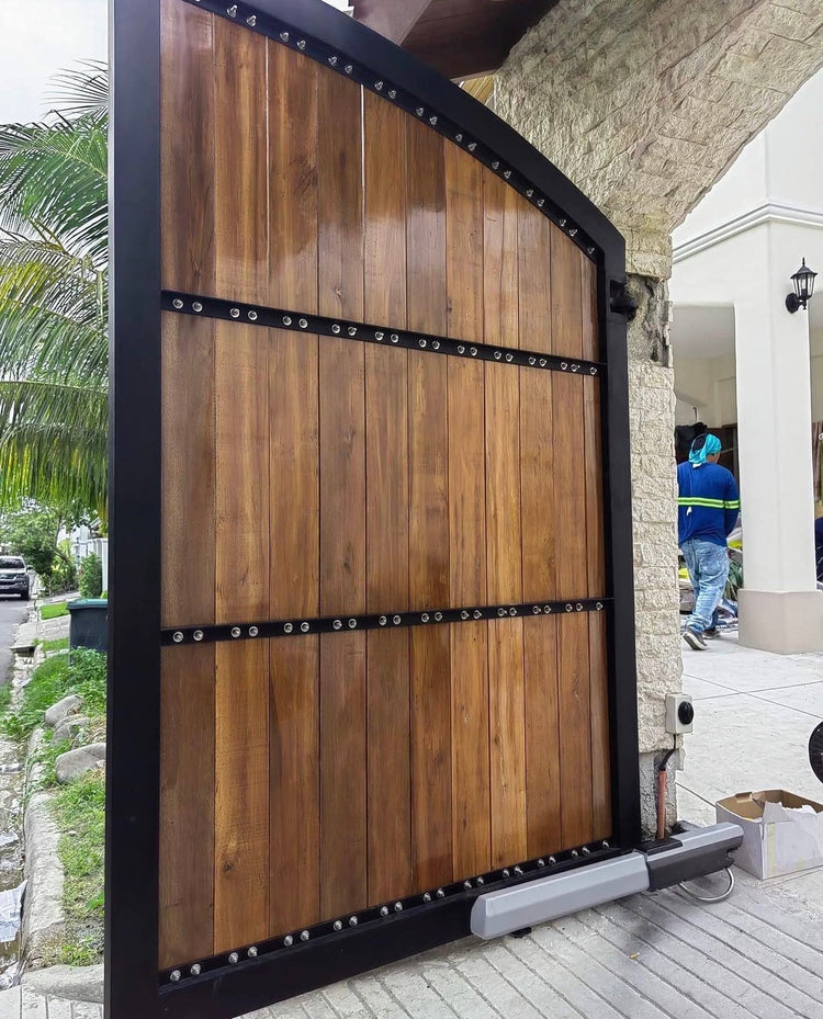 Installation detail of the Mediterranean-style steel and Yakal wood gate