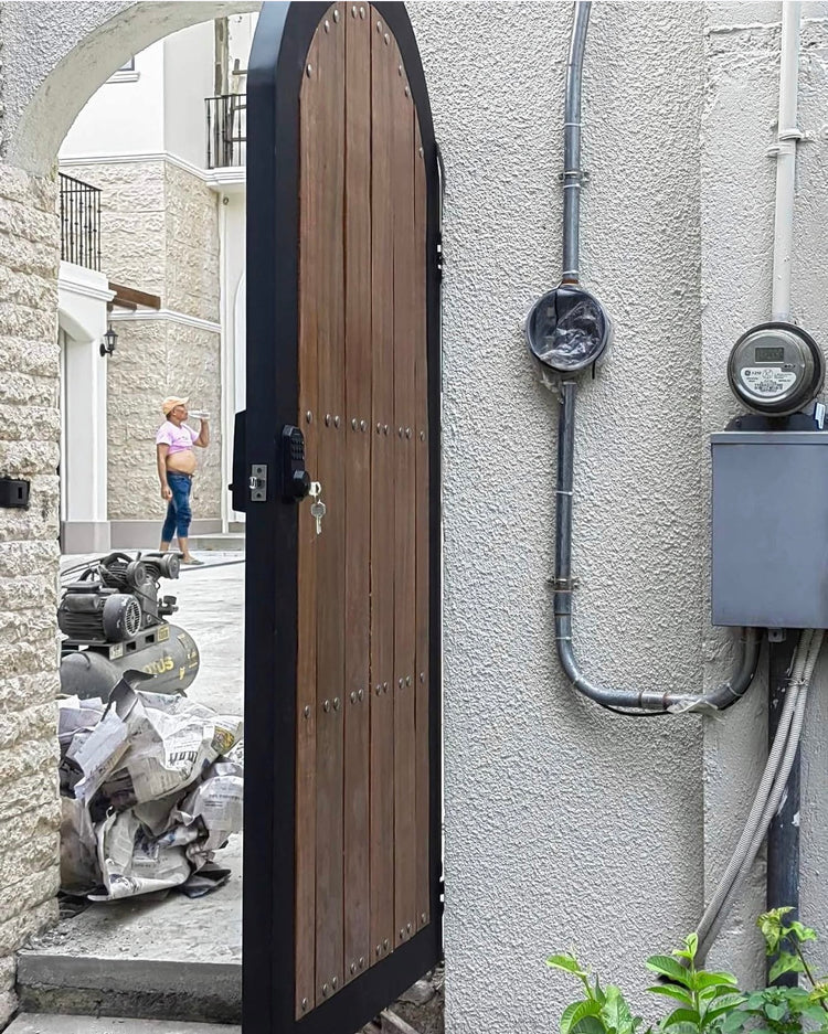 Installation detail of the Mediterranean-style steel and Yakal wood gate