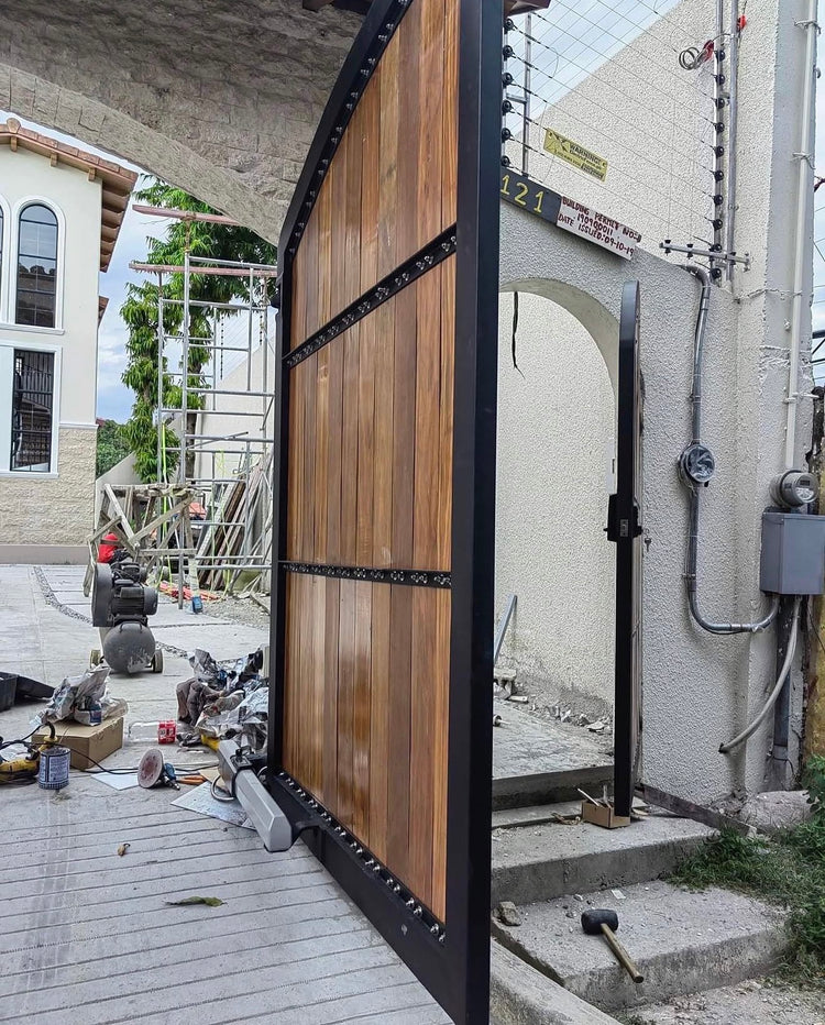 Installation detail of the Mediterranean-style steel and Yakal wood gate